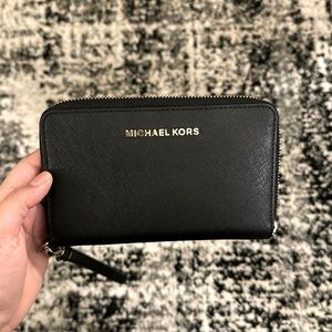 Black Michael Kors wallet.